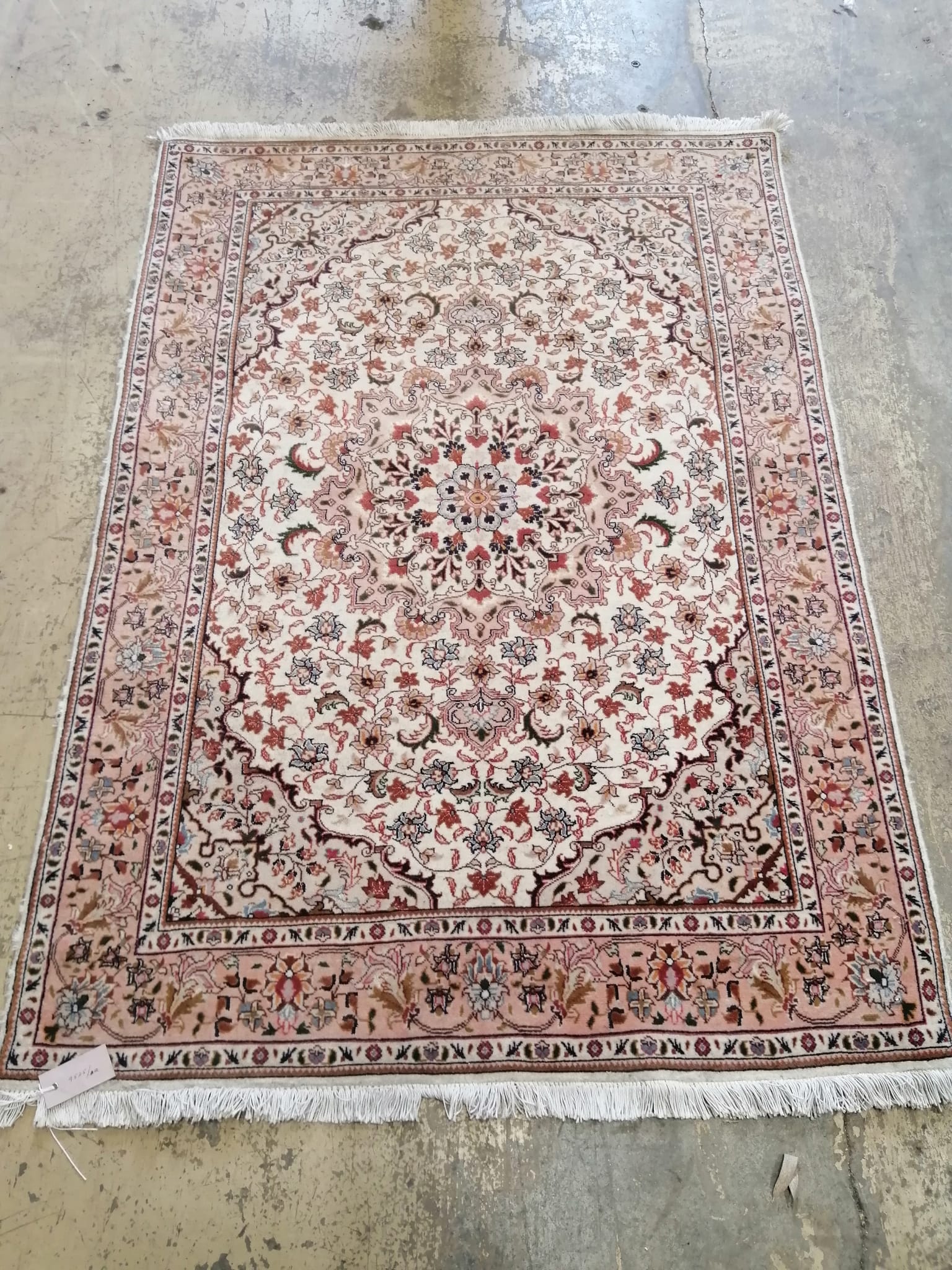 A Persian cream ground runner, 147 x 101cm